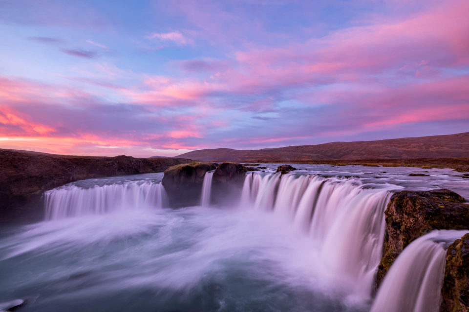 Long exposure of Godafoss waterfall in Iceland during a colorful sunrise